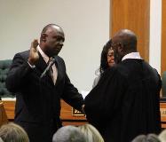 Larry taking the oath of office